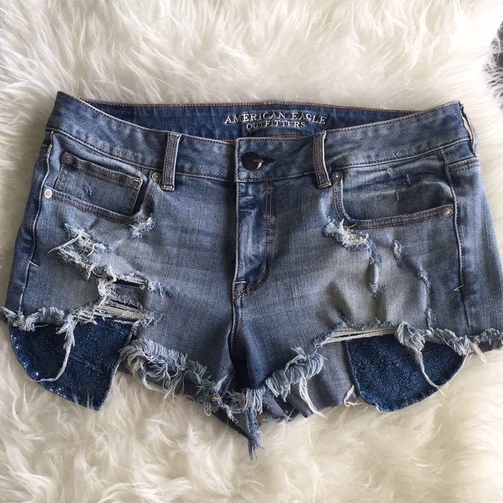 Destroyed denim cutoff shorts